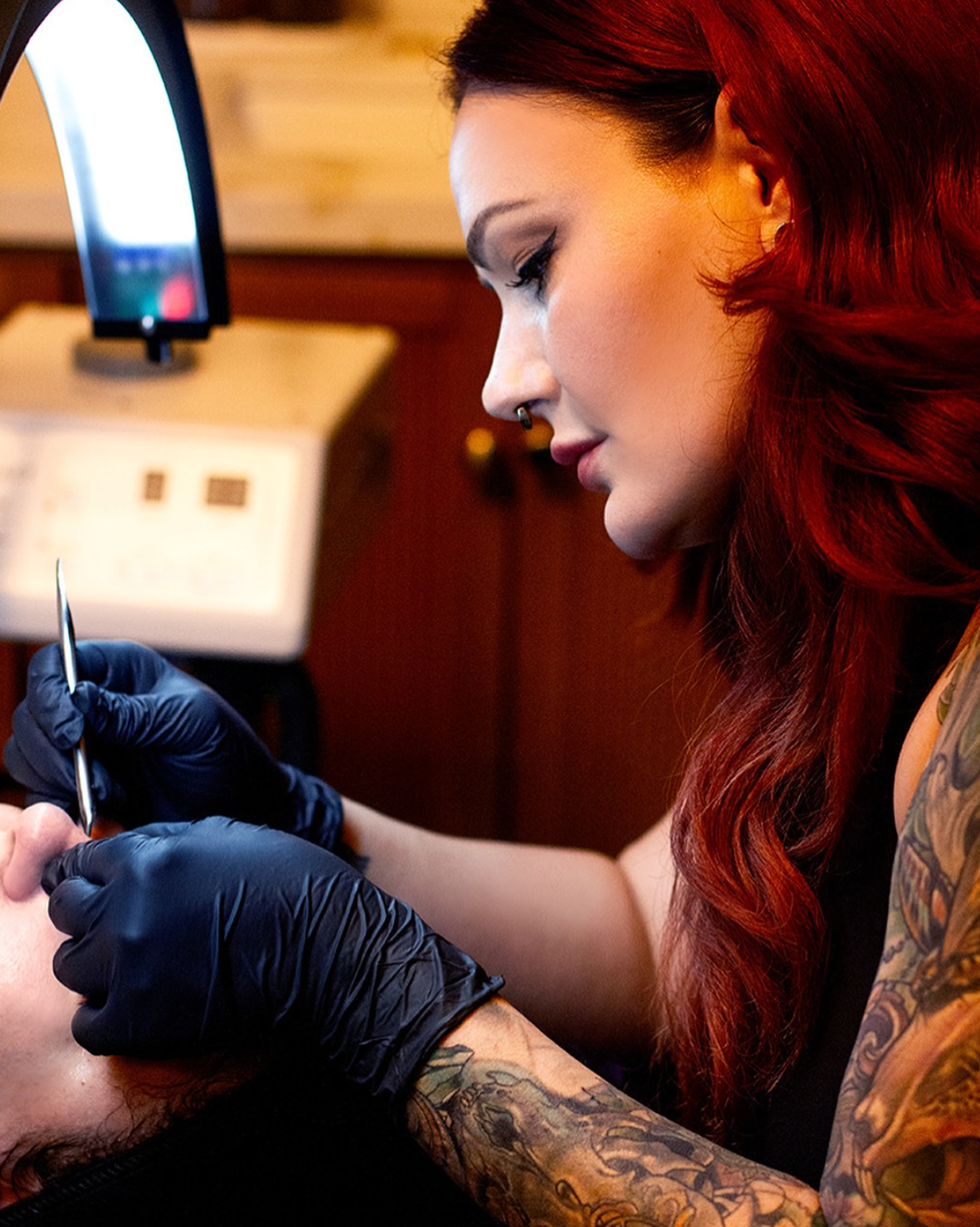Leigh Ann Caryl performing an advanced skincare treatment